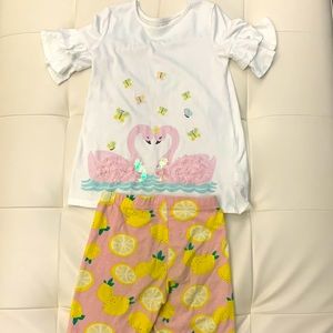 Long lemon shorts and a swan top